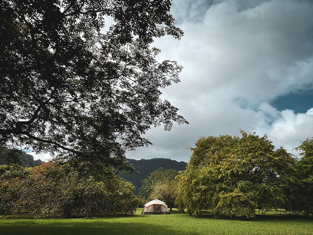 A beige tent in the permited campgrounds at Ho‘omaluhia